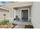 Inviting front porch with a chair, providing a relaxing spot by the front door at 7233 Lumber Port Dr, Ruskin, FL 33573