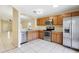 Open kitchen boasts stainless steel appliances and ample counter space, perfect for entertaining at 7233 Lumber Port Dr, Ruskin, FL 33573