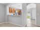 The kitchen is equipped with stainless steel appliances, wooden cabinets, and an open view to the backyard at 7233 Lumber Port Dr, Ruskin, FL 33573