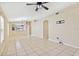 Spacious open-concept living area with tile flooring and arched doorways at 7233 Lumber Port Dr, Ruskin, FL 33573