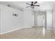 Modern living room with tiled floors, high ceilings, a ceiling fan, and neutral wall color at 7233 Lumber Port Dr, Ruskin, FL 33573