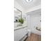 Bathroom with a modern vanity and tub featuring white tile surround and glass shower at 7239 55Th N Ave, St Petersburg, FL 33709