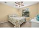 Cozy bedroom with a ceiling fan, a bright window, and neutral-toned decor at 7244 Hamilton Rd # 7244, Bradenton, FL 34209