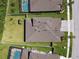 An aerial view of a home with a large backyard, showcasing its fence, and proximity to other homes at 8766 Shadyside Ln, Land O Lakes, FL 34637