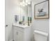 Stylish bathroom with modern vanity, mirror, and charming decor at 8766 Shadyside Ln, Land O Lakes, FL 34637