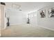 Spacious bonus room with neutral carpet, exercise bike, and modern decor at 8766 Shadyside Ln, Land O Lakes, FL 34637