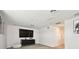 Bonus room with large TV, modern media console, and recessed lighting at 8766 Shadyside Ln, Land O Lakes, FL 34637