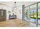 Bright dining area with stainless steel refrigerator and sliding glass doors leading to the outdoor patio and landscaped yard at 8766 Shadyside Ln, Land O Lakes, FL 34637