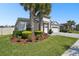 Charming single-story home with manicured lawn and garden in a desirable neighborhood at 8766 Shadyside Ln, Land O Lakes, FL 34637