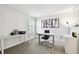 Home office with modern glass desk, comfortable office chair, and sports decor at 8766 Shadyside Ln, Land O Lakes, FL 34637