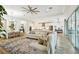 Expansive living area with an open layout, showcasing the dining area, modern kitchen, and a comfortable lounging space at 8766 Shadyside Ln, Land O Lakes, FL 34637