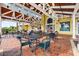 Inviting outdoor space with covered seating area perfect for relaxing and socializing with wrought iron tables and chairs at 8766 Shadyside Ln, Land O Lakes, FL 34637