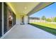 Covered patio with a screened enclosure and a spacious area overlooking the backyard at 8766 Shadyside Ln, Land O Lakes, FL 34637