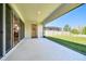 Covered patio featuring a screened enclosure and a spacious area overlooking the backyard at 8766 Shadyside Ln, Land O Lakes, FL 34637