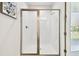 Bathroom featuring a tiled shower with a glass door and bronze trim at 8766 Shadyside Ln, Land O Lakes, FL 34637