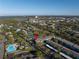 Scenic aerial view of condo complex near lakes and the bay, featuring amenities like pool and courts at 11436 2Nd N St # 4, St Petersburg, FL 33716