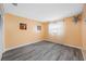 Bedroom featuring wood-look flooring, window for natural light, and modern interior paint at 119 13Th Ave, Indian Rocks Beach, FL 33785