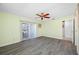 Spacious bedroom featuring wood-look flooring and a sliding glass door for seamless outdoor access at 119 13Th Ave, Indian Rocks Beach, FL 33785
