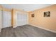 Cozy bedroom with wood-look flooring, a closet, and peach-toned walls adorned with decorative pictures at 119 13Th Ave, Indian Rocks Beach, FL 33785
