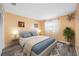 Cozy bedroom with wood-look flooring, a modern ceiling fan, and plenty of natural light at 119 13Th Ave, Indian Rocks Beach, FL 33785