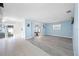 Spacious living room with an open layout, blending tile and wood-look flooring at 119 13Th Ave, Indian Rocks Beach, FL 33785