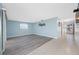 Expansive living room featuring hardwood flooring, large windows, and a clean, modern design at 119 13Th Ave, Indian Rocks Beach, FL 33785