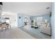 Bright and spacious living room with stylish decor, sliding glass doors, and an open floor plan at 119 13Th Ave, Indian Rocks Beach, FL 33785