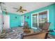Charming patio features eye-catching turquoise walls, stylish flooring, and comfortable seating area at 119 13Th Ave, Indian Rocks Beach, FL 33785
