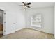 Bedroom with neutral carpet and window at 1210 Paradise Lake Dr, Tarpon Springs, FL 34689