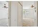 View of bedrooms shows natural light, plush carpeting, and convenient closet access at 1210 Paradise Lake Dr, Tarpon Springs, FL 34689