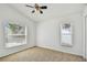 Bedroom with ceiling fan at 1210 Paradise Lake Dr, Tarpon Springs, FL 34689