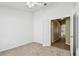Cozy bedroom with neutral carpet and doorway to adjacent living space at 1210 Paradise Lake Dr, Tarpon Springs, FL 34689