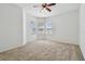 Inviting bedroom with a ceiling fan and multiple windows offering ample sunlight at 1210 Paradise Lake Dr, Tarpon Springs, FL 34689