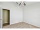 Bedroom features neutral carpet, ceiling fan, and closet at 1210 Paradise Lake Dr, Tarpon Springs, FL 34689