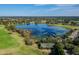 Breathtaking aerial view of a serene lake surrounded by verdant landscapes at 1210 Paradise Lake Dr, Tarpon Springs, FL 34689
