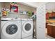 Functional laundry room with side-by-side washer and dryer at 12204 Sun Vista W Ct, Treasure Island, FL 33706