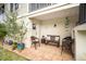 Charming covered patio seating area provides a relaxing outdoor space at 12204 Sun Vista W Ct, Treasure Island, FL 33706