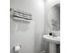 A charming powder room features a pedestal sink and decorative towels at 12309 Grizzly Ln, New Port Richey, FL 34654