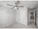 Cozy bedroom with a ceiling fan and soft carpet at 12309 Grizzly Ln, New Port Richey, FL 34654