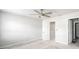 Bright bedroom features a modern ceiling fan and neutral color palette at 12309 Grizzly Ln, New Port Richey, FL 34654