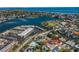 A picturesque aerial view capturing a neighborhood by the bay, blending residential charm with stunning natural beauty at 1233 Eden Isle Ne Dr, St Petersburg, FL 33704