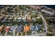 An aerial view capturing a mix of residential homes and condominiums nestled along the bay, offering serene waterfront living at 1233 Eden Isle Ne Dr, St Petersburg, FL 33704