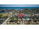 An aerial view of a waterfront home surrounded by canals, offering picturesque scenery and convenient access to boating activities at 1233 Eden Isle Ne Dr, St Petersburg, FL 33704