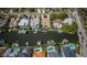 An aerial view capturing waterfront homes with private docks and pools, providing serene beauty and exclusive amenities at 1233 Eden Isle Ne Dr, St Petersburg, FL 33704