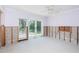 Bedroom featuring natural light and backyard access at 1233 Eden Isle Ne Dr, St Petersburg, FL 33704