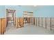Bedroom showing open closet space and access to the bathroom at 1233 Eden Isle Ne Dr, St Petersburg, FL 33704