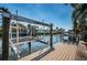 Dock with an installed boat lift offers a convenient way to access the water at 1233 Eden Isle Ne Dr, St Petersburg, FL 33704