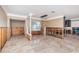 Dining room with marble floors, column, modern light fixture, and window views at 1233 Eden Isle Ne Dr, St Petersburg, FL 33704