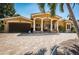 Inviting single-Gathering home featuring a charming facade, meticulously maintained lawn, and a spacious driveway at 1233 Eden Isle Ne Dr, St Petersburg, FL 33704