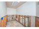 Hallway with access to multiple rooms at 1233 Eden Isle Ne Dr, St Petersburg, FL 33704